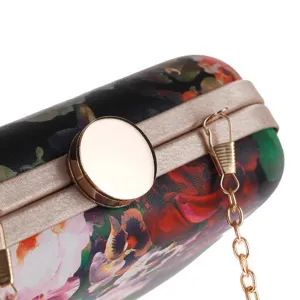 Elegant floral print evening clutch bag with round gold clasp and chain strap for women.