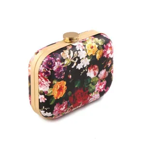 Women hardcase floral printed clutch bag with gold metal frame and top clasp for evening party.