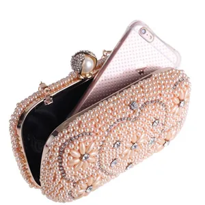 Elegant pearl evening clutch bag with sparkling rhinestones, perfect for parties and weddings.