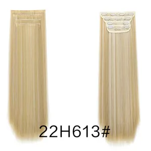 Synthetic straight hair extensions detail view, 4-piece clip in blonde hair style.