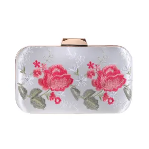 Exquisite silver satin evening clutch bag featuring delicate pink rose floral embroidery and gold hardware.