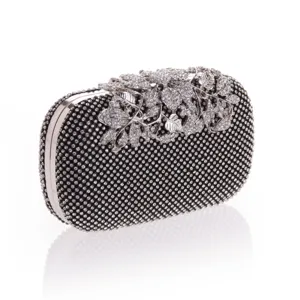 Stunning crystal evening clutch bag with sparkling rhinestones and elegant floral clasp design.