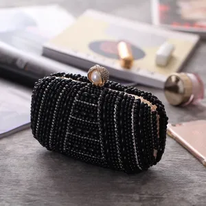 Elegant black beaded evening clutch bag with sparkling rhinestones and a pearl clasp.