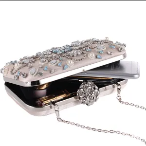 Elegant satin evening clutch bag with sparkling rhinestones, pearls and a chic floral clasp.