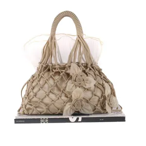 Elegant champagne handmade mesh handbag with floral lace and delicate tulle lining for wedding.