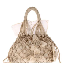 Handmade woven net handbag featuring elegant fabric rose details and delicate sheer tulle lining.
