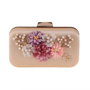 Elegant golden evening clutch bag with artificial flowers and faux pearls for women parties.