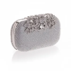 Detailed view of the sparkling rhinestone evening clutch with elegant floral crystal clasp.