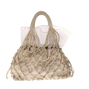 Exquisite beige handmade woven mesh bag detail showing delicate knit pattern and inner pouch lining.
