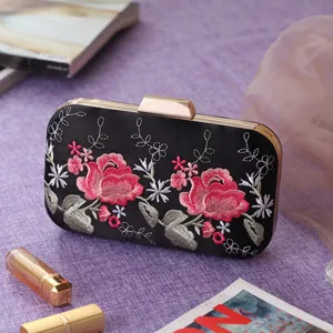 Elegant black satin evening clutch featuring stunning pink rose embroidery and chic gold hardware.