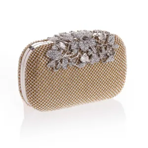 Stunning gold rhinestone evening clutch bag with sparkling crystal leaf design for party.