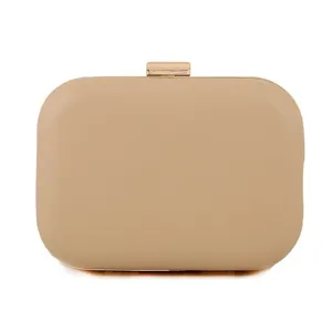 Beige PU hard shell evening clutch bag with gold tone metal clasp detail close up view