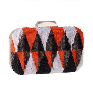 Exquisite beaded clutch bag with geometric pattern, luxury evening purse with gold-tone hardware.
