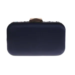 Dark blue satin evening clutch bag detail showing metal clasp and bead embellishment.