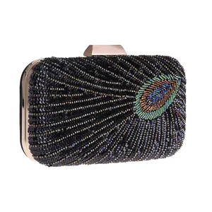 Elegant black sequin peacock clutch bag with gold metal frame, perfect for evening parties.