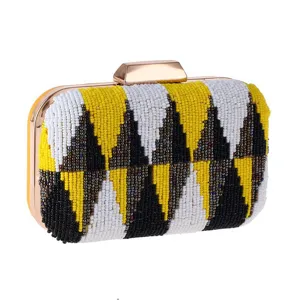 Beaded evening clutch bag with chic geometric pattern, vibrant color-blocking and metallic frame.
