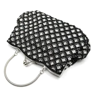 Elegant beaded evening clutch bag with metal handle and fish scale design for women events.