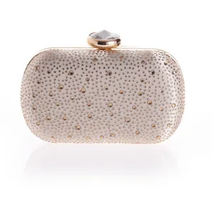 Exquisite rhinestone evening clutch bag detail, sparkling crystals and gold metal frame.