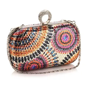 Elegant women's sequin evening clutch bag with chain strap and rhinestone ring clasp for party.