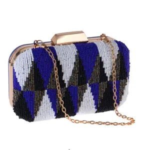 Elegant beaded evening clutch bag with geometric contrast colors, gold chain and metal clasp.