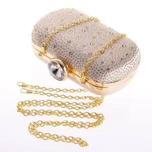 Elegant rhinestone evening clutch bag with detachable gold chain and crystal clasp for women.