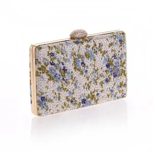 Floral crystal evening clutch bag detail, gold metal frame and rhinestone clasp for women.