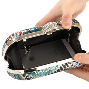 Sequin evening clutch bag for women, polyester sparkly party handbag with rhinestone clasp detail.