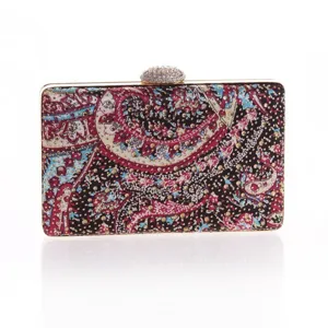 Detailed view of the elegant paisley print evening clutch featuring sparkling rhinestone clasp trim.