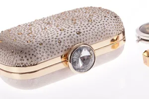 Rhinestone evening clutch bag for women, sparkling crystal detail and gold frame design for banquet.