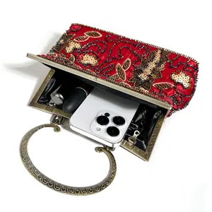 Vintage red beaded evening bag detail, showing exquisite embroidery and interior capacity.