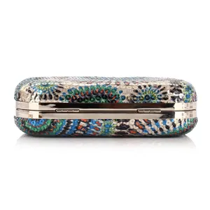 Glittering sequin surface detail of the elegant evening clutch bag with metal frame.
