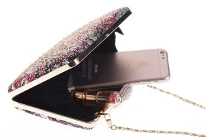 Detail view of a stunning rhinestone printed evening clutch bag showing spacious interior capacity.
