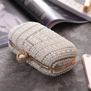 Exquisite handmade pearl rhinestone evening clutch bag detail showing delicate beadwork.
