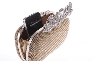 Stunning rhinestone evening clutch bag with crystal leaf clasp and glittering crystals.