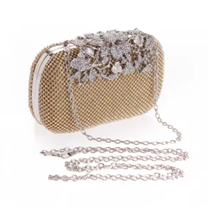 Gold rhinestone evening clutch bag with elegant crystal floral decoration and silver chain.