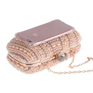 Handmade pearl rhinestone evening clutch bag detail shot, elegant bridal party purse.
