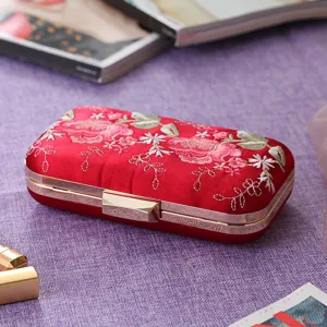 Red embroidered rose evening clutch bag with gold metal frame, elegant floral design details.