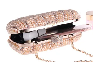 Handmade pearl rhinestone evening clutch bag with chain strap and spacious interior.