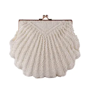 Handmade white beaded shell evening bag, detailed close-up showing delicate pearl beads.