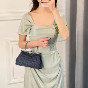 Elegant evening clutch bag with sparkling beads and vintage metal clasp for women parties.