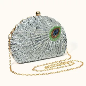 Silver sequin clutch bag with peacock feather bead embroidery and gold chain strap details.