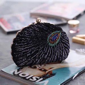 Vintage black sequined beaded evening clutch bag, exquisite shell shape design for parties.