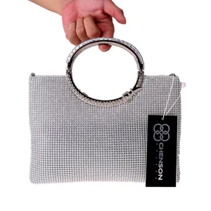 Silver rhinestone evening handbag with round metal ring handle and chic design detail view.