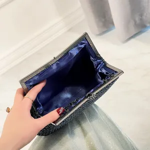 Elegant beaded evening clutch bag with dark blue satin lining and vintage metal frame.