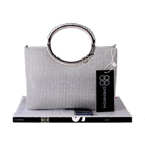 Detailed view of the sparkling rhinestone evening handbag with elegant metal round handle.