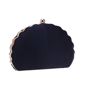 Vintage beaded evening clutch bag with metal frame, elegant dark blue shell design for parties.