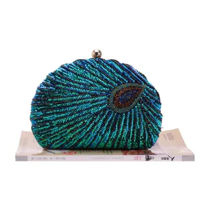 Exquisite detail shot showcasing the intricate beadwork and shimmering sequins of the peacock clutch.
