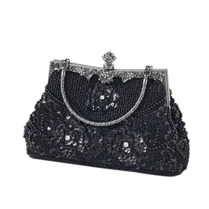 Exquisite black beaded sequin evening bag detail, elegant metal frame and delicate embroidery.