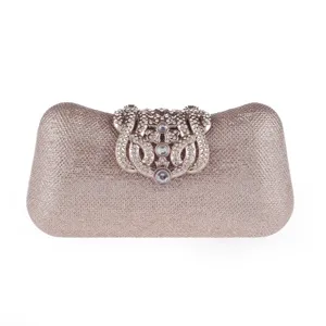 Close-up of sparkling glitter evening clutch bag with ornate rhinestone metal clasp detail.