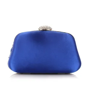 Royal blue satin evening clutch bag detail, featuring exquisite rhinestone clasp closure.
